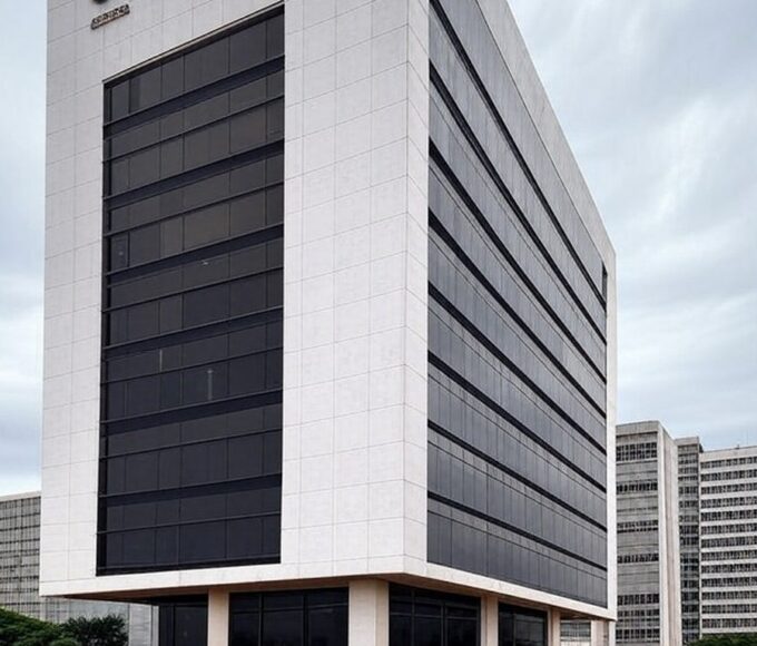 Edifício da Caesb em Brasília com documentos de concurso sob céu nublado, representando frustração de candidatos no DF.